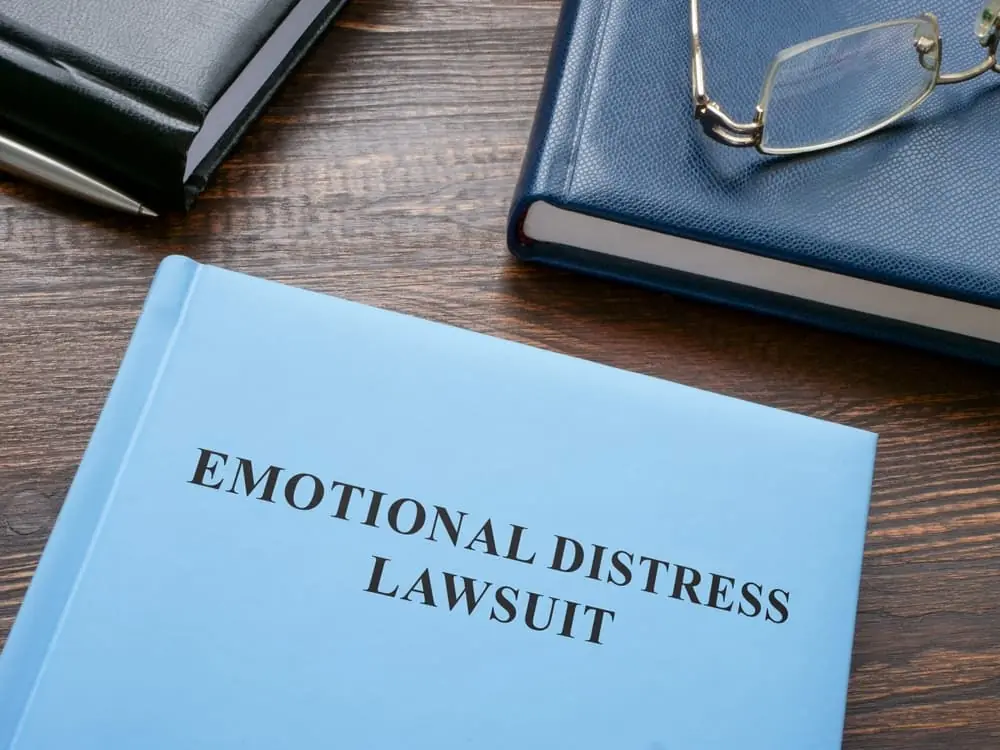 Notepads with "Emotional Distress Lawsuit" written on them.






