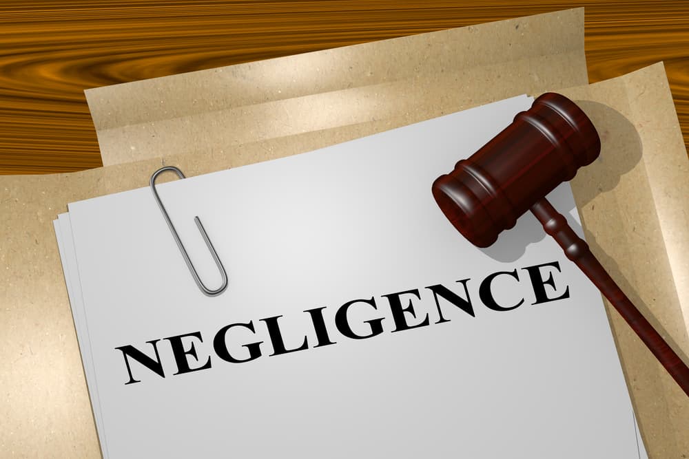 3D illustration of the word "NEGLIGENCE" prominently displayed on legal documents. Concept representing legal accountability and responsibility.






