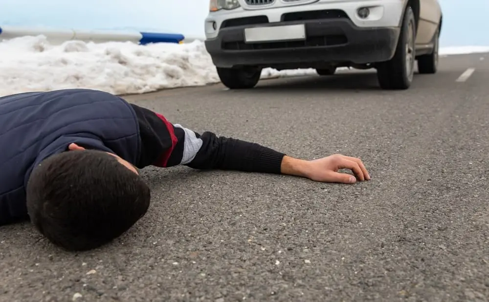 Horizontal view of a man struck by a car in a hit-and-run incident.